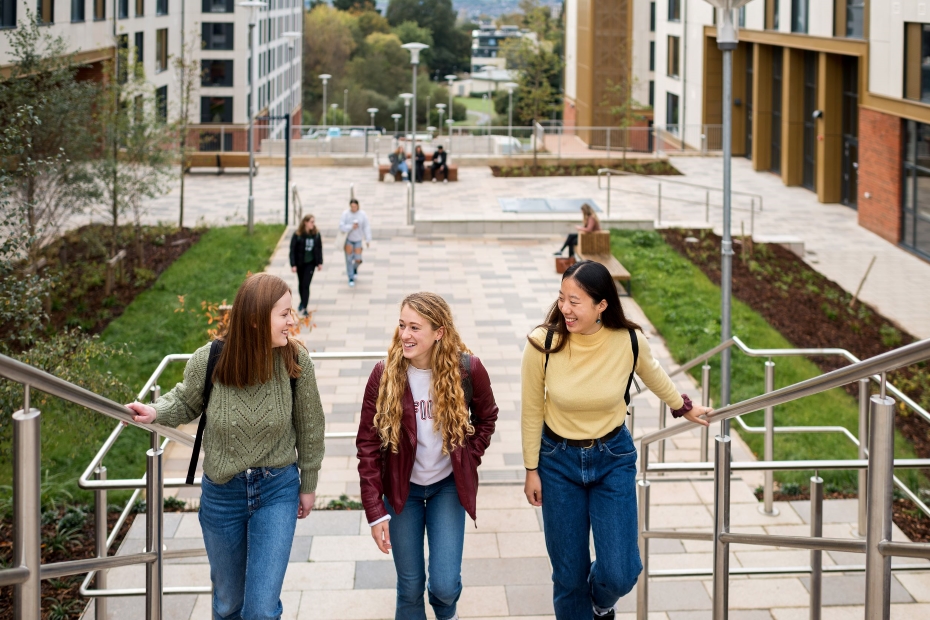three girls walking up stairs outside East Park accommodation