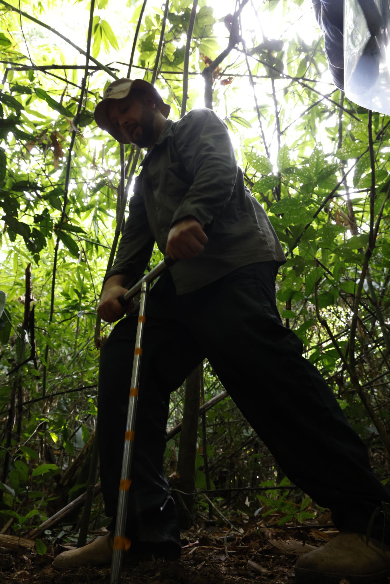 Dr. Wanderlei Bieluczyk collecting soil cores with an auger in burned forest plots, Acre, Brazil
