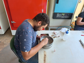 Technician Gabriel preparing and grinding Amazon PyroCarbon soil samples at the laboratory bench