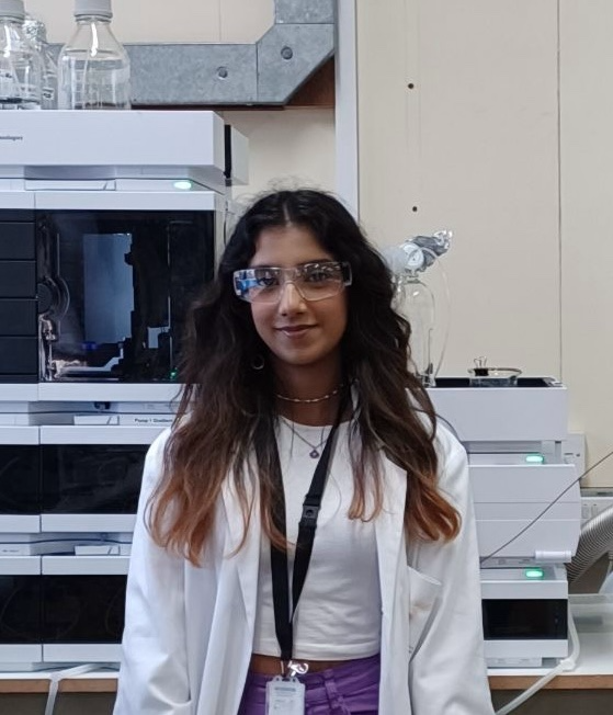 Photo of Rosemary Rupesinghe in a lab coat
