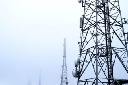 A photo of communications masts in the mist