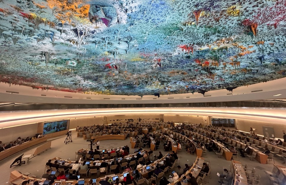The ceiling at the UN headquarters is stippled with plaster in dripping organic shapes, it is brightly coloured, mostly blue, and seems to glow from within