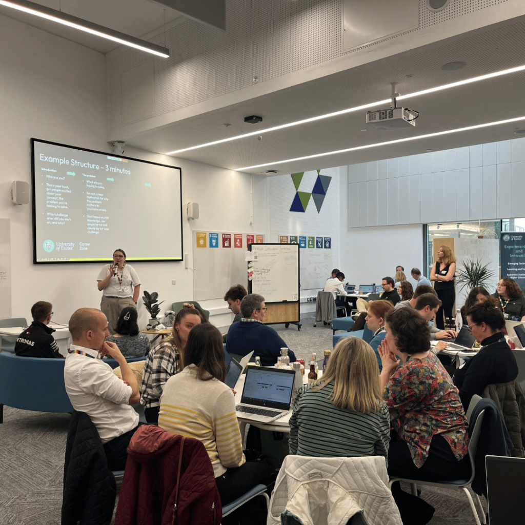 A partcicpant presenting their work to the group at the end of the day. 