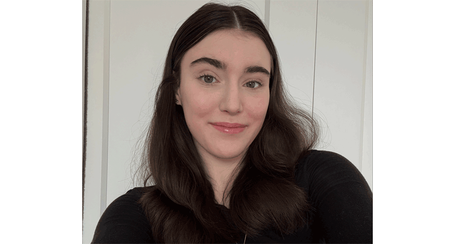 Student on plain background in black top