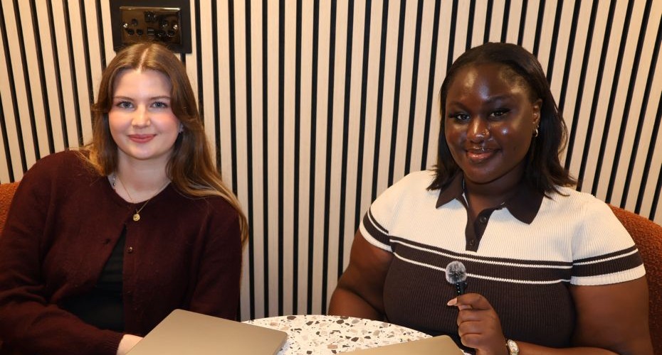 Pippa and Davina smiling at the camera as they prepare to record a podcast.