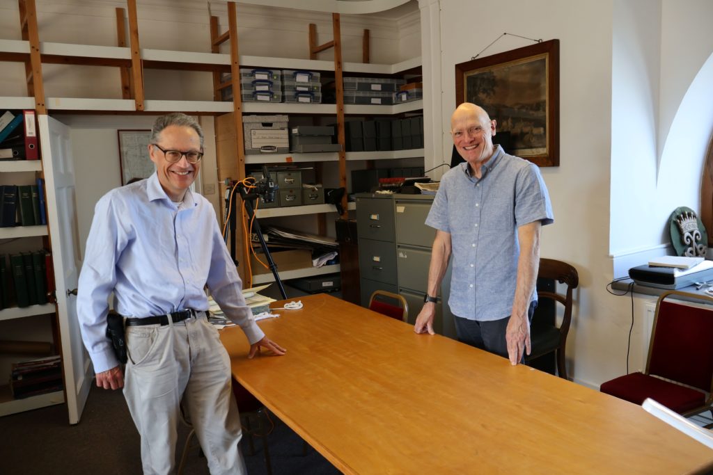 Picture of Henry French and Des Atkinson in the archives at Holkham Hall.