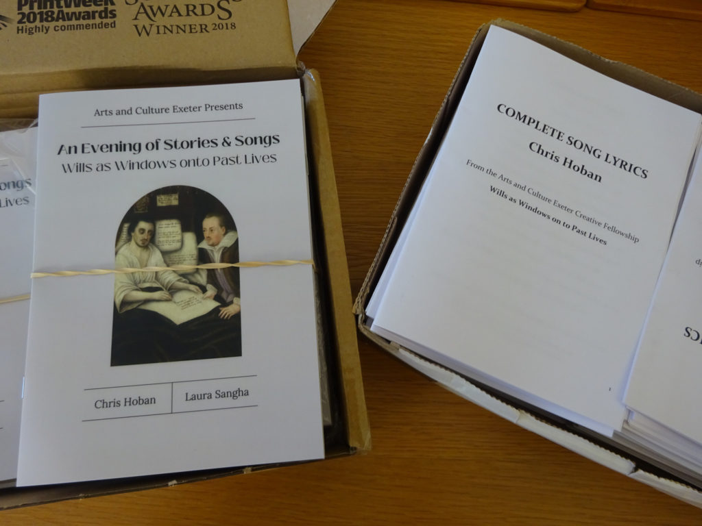 A table covered in event programmes