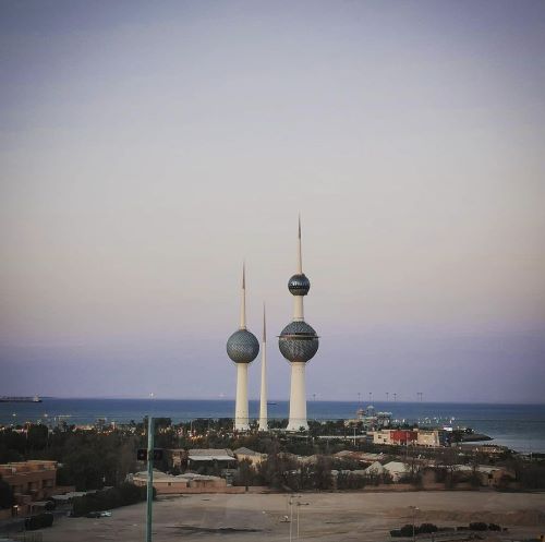 Sunset photo of three iconic towers by the sea in Kuwait