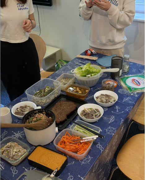 A table filled with different dishes of Asian food