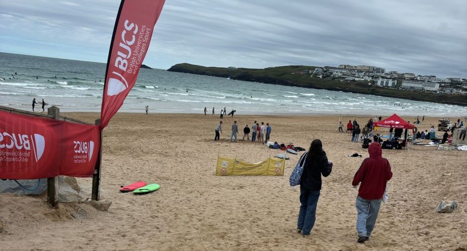 Red flags advertising a surf competition on a beach