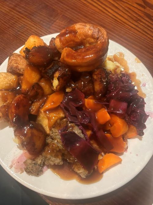 Roast potatoes, stuffing, vegetables, a Yorkshire pudding and gravy