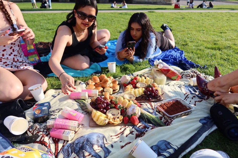 Students enjoying a picnic in the sun