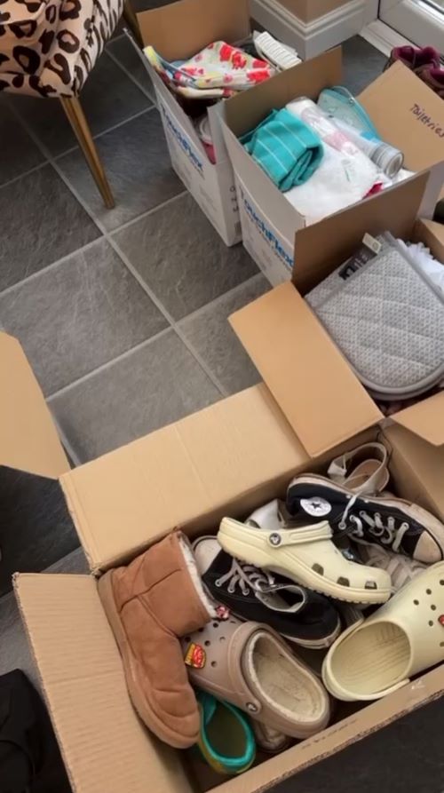 Packing boxes on a kitchen floor