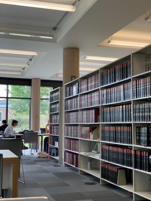 Rows of books and study tables in Streatham Campus library