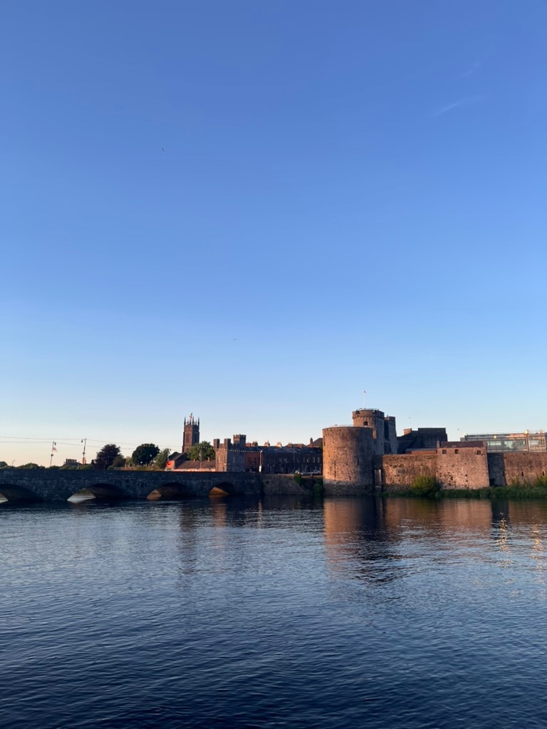 View over a river of a stone bridge and historic buildings
