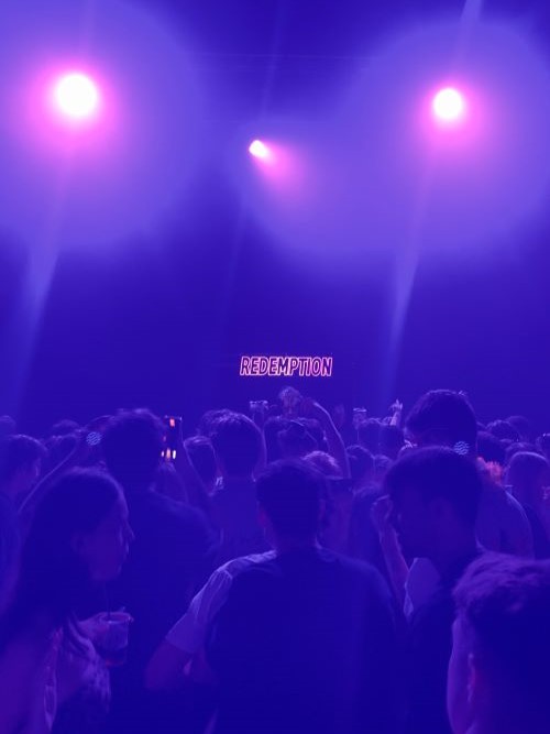 Students in a purple-lit nightclub