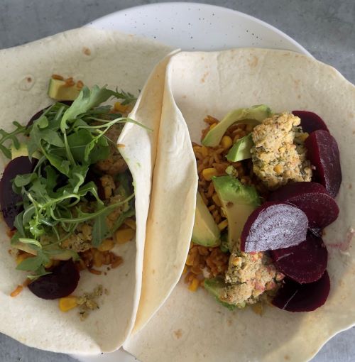 Tortilla wraps filled with falafels, salad and vegetables