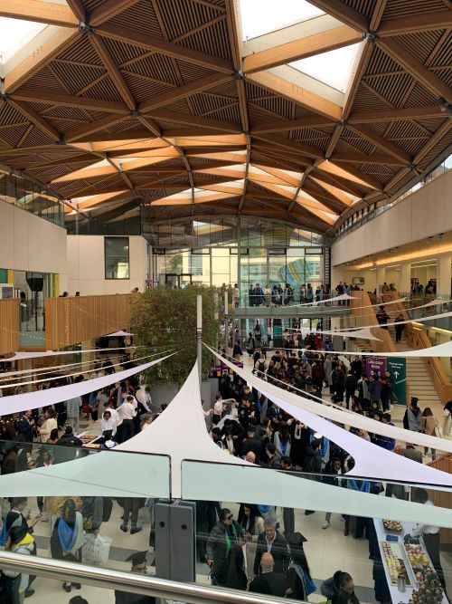 Streatham Campus Forum building atrium filled with students graduating