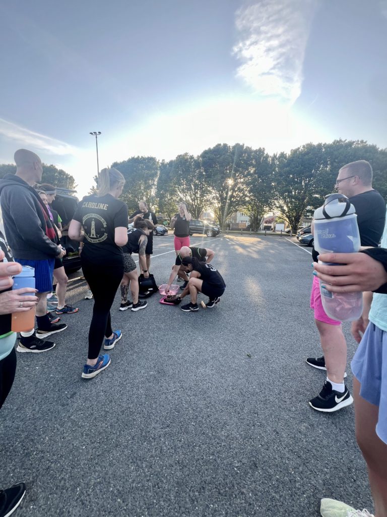 Plymouth Fitness Company celebrating a birthday with chocolate cake 