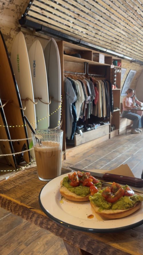 Bagels and an iced coffee on a coffee shop table
