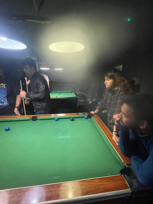 Students playing snooker