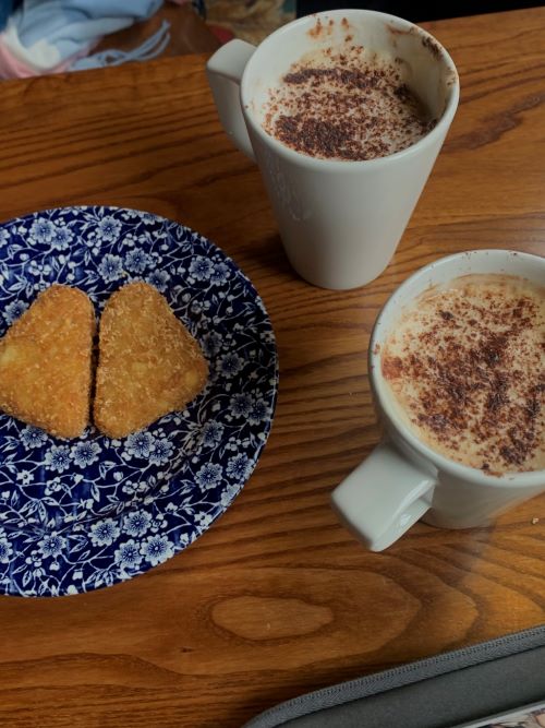 Two coffees and two hah browns