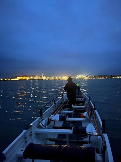 A pilot gig boat at flushing beach, faced towards Falmouth harbour.