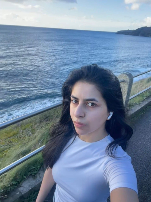 A student out for a run next to the sea