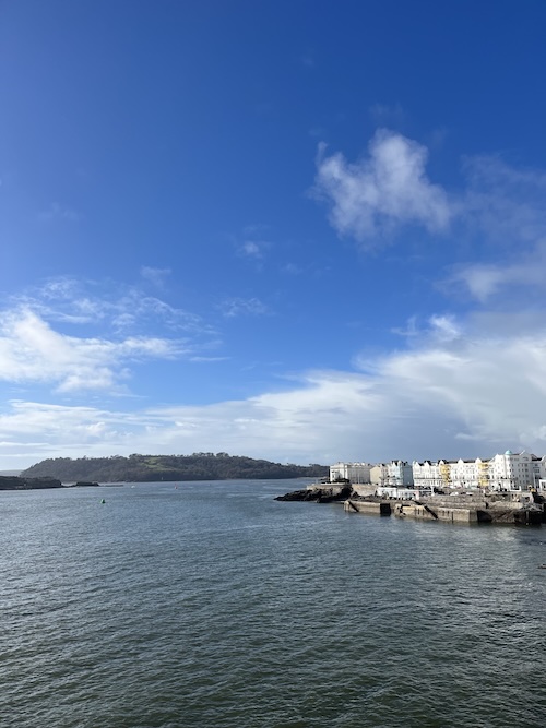 A view of the sea and beach houses at Plymouth