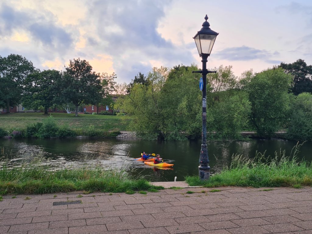 Two people in kayaks on the river