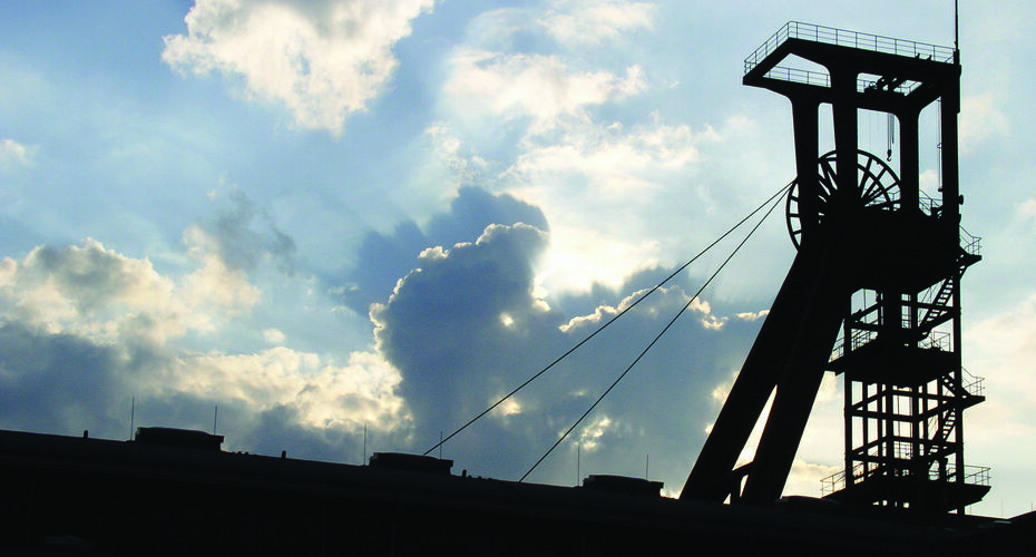 Silhouette of mine equipment against the sky