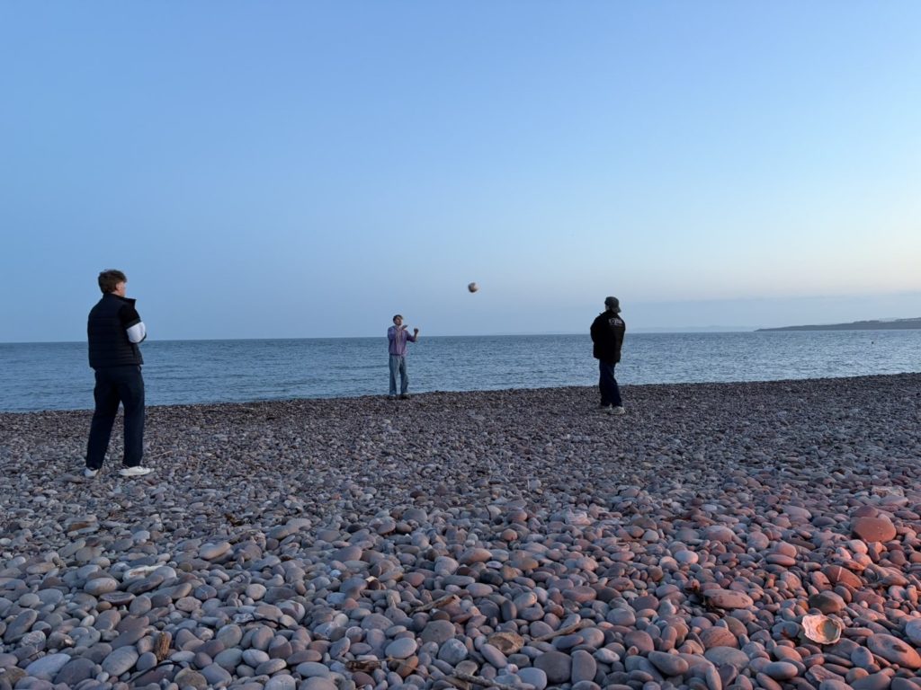 George on the beach at Budleigh Salterton playing ball games with his friends