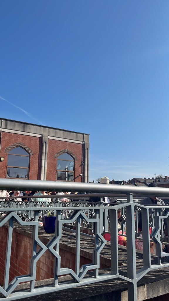 External view of the mosque showing railings with an eight-pointed star design.