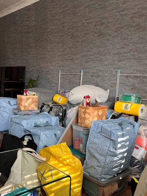 Room filled with bags packed to go to uni.