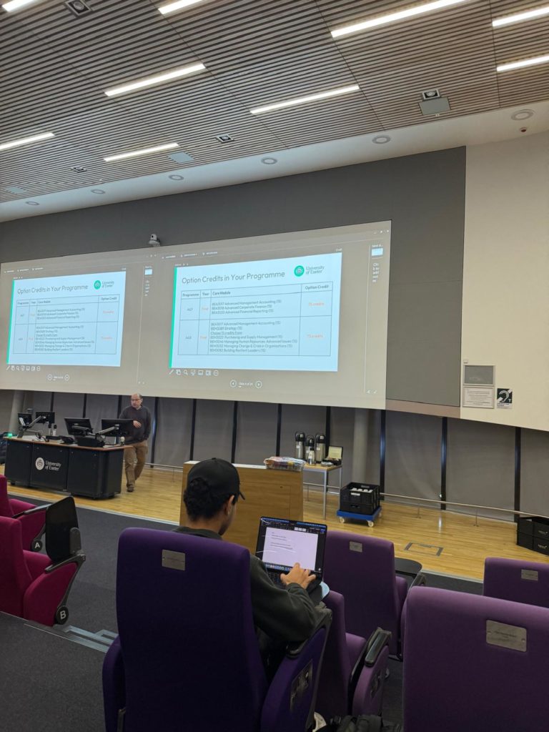 Photo of a lecture taking place in the Alumni Auditorium lecture theatre in the Forum Building