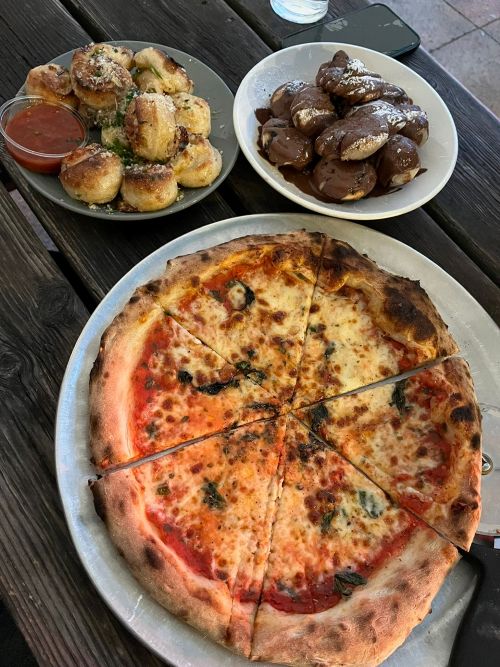 Margerita pizza and cheesy and nutella doughballs at Fives.