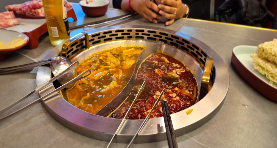 Food cooking at restaurant table