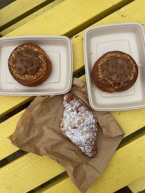an almond crossaint and 2 chocolate creme pastries.