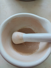 Ground Amazon PyroCarbon soil sample in a mortar and pestle at the CENA laboratory