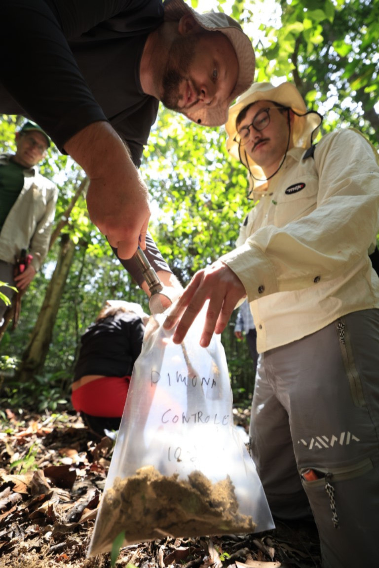 Amazon PyroCarbon Project researchers collecting soil samples in the central Amazon forest near Manaus, Brazil