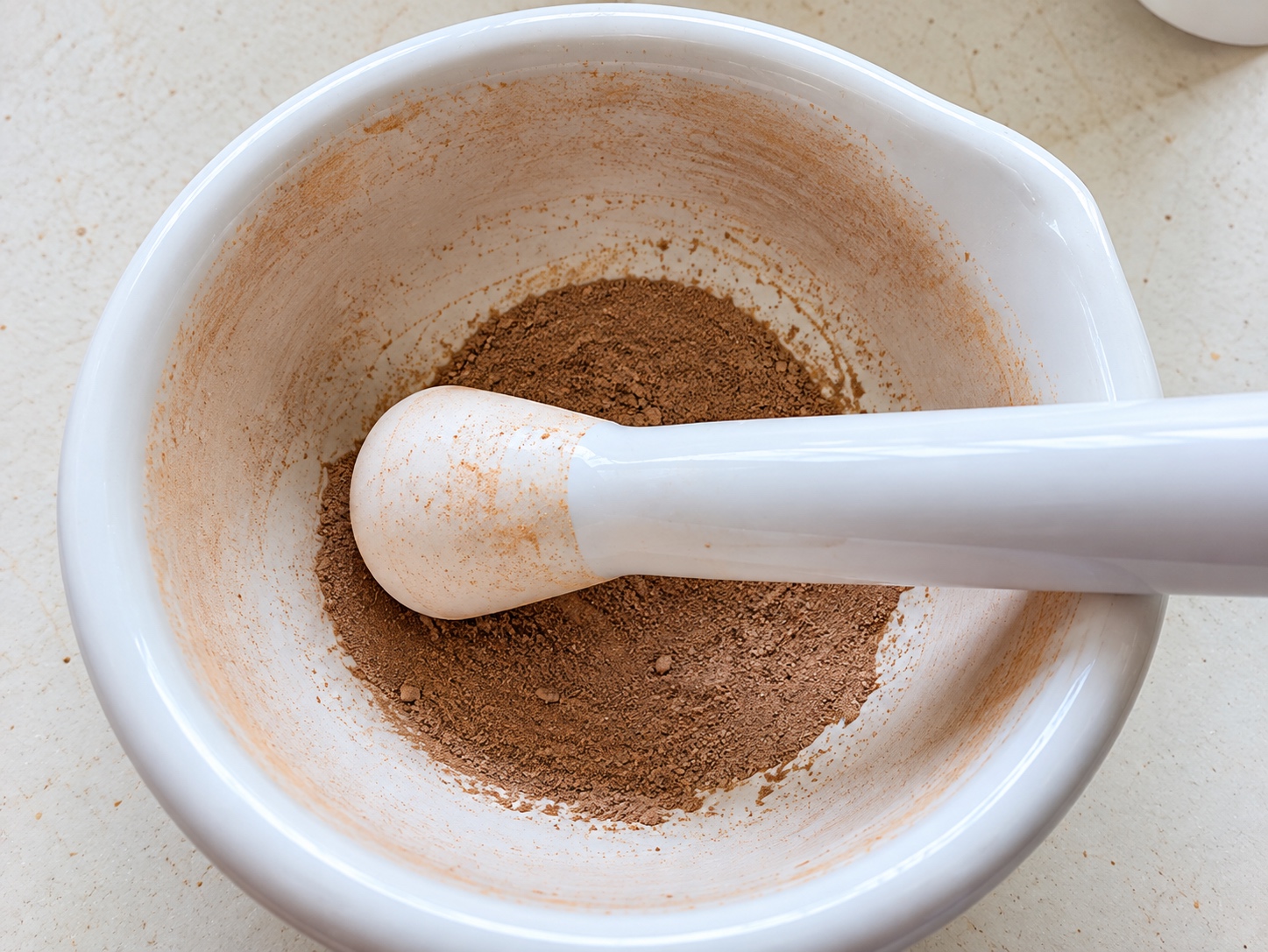 Ground Amazon PyroCarbon soil sample in a mortar and pestle at the CENA laboratory